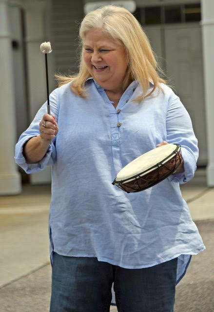 Woman playing hand drum