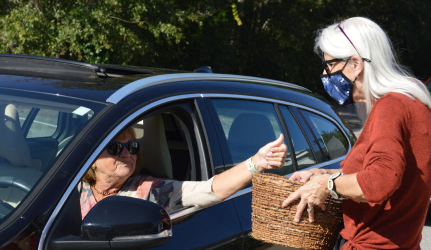 Woman in car giving a donation
